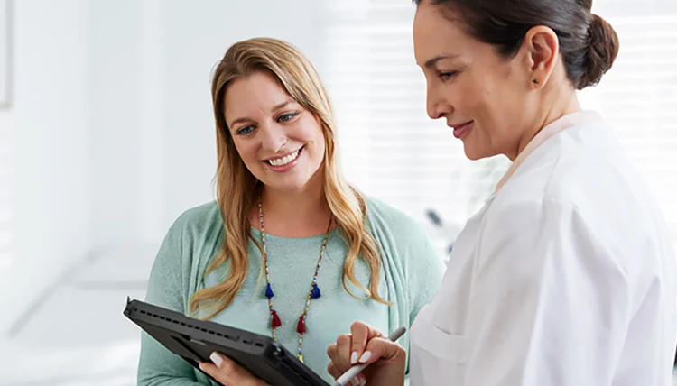 Kristen, a real person with narcolepsy taking WAKIX, talking with her healthcare provider